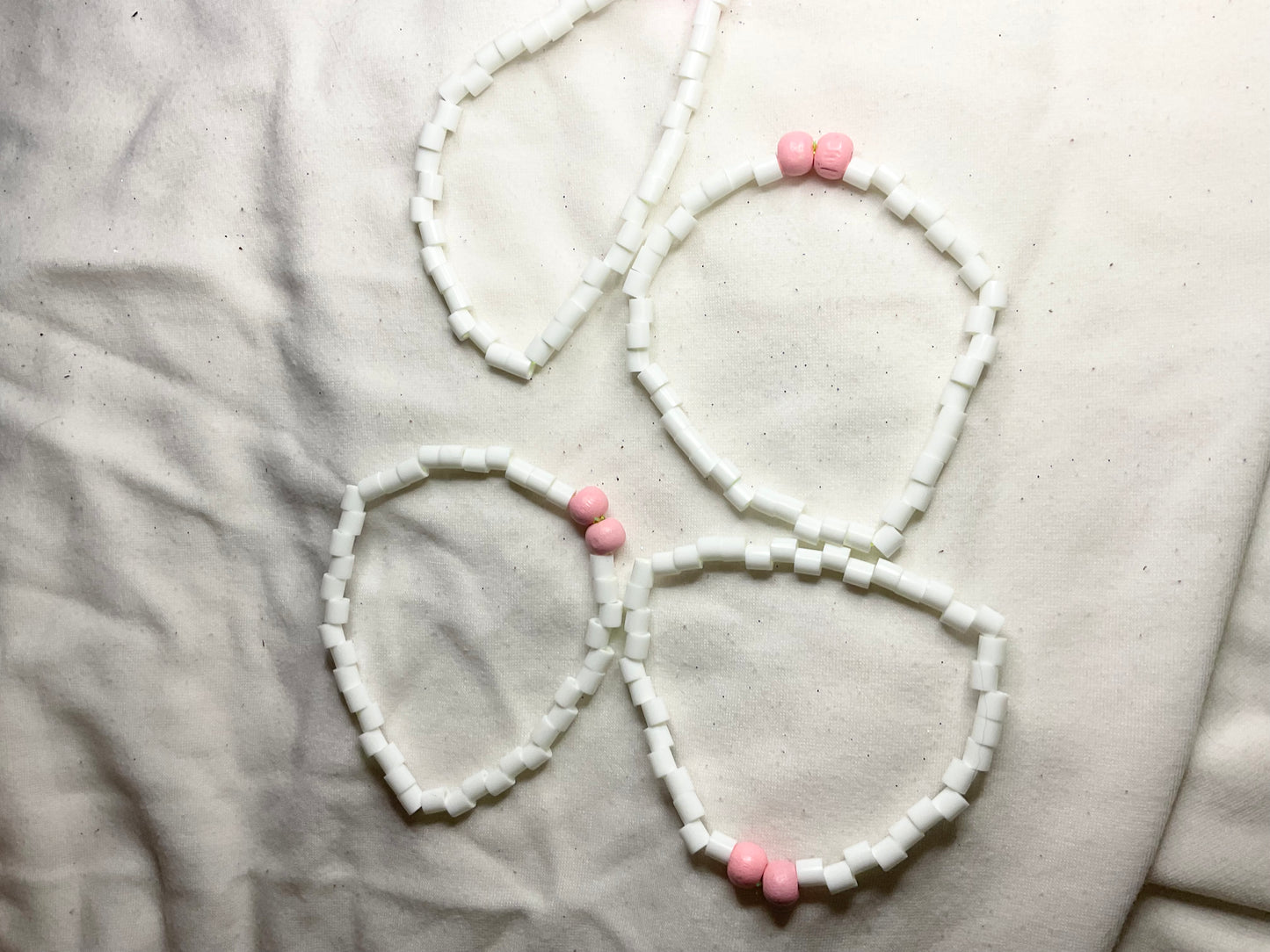 White Bead Bracelet with Pink Pony Beads