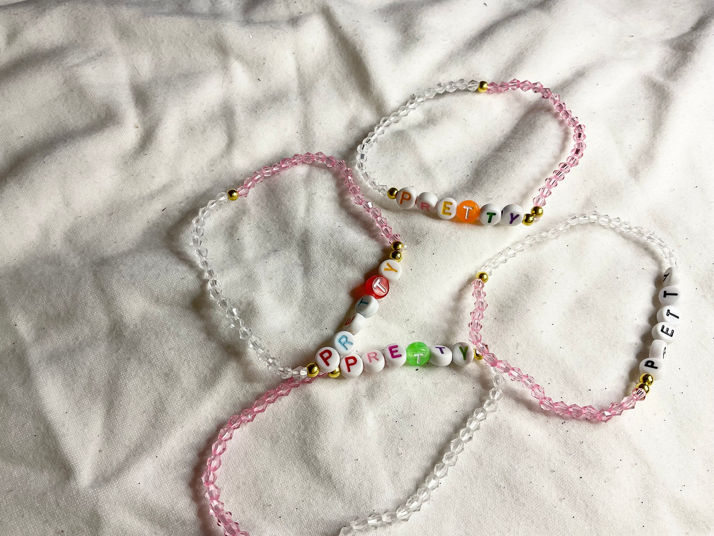 Pink and Clear Small Bead Bracelet with Word PRETTY